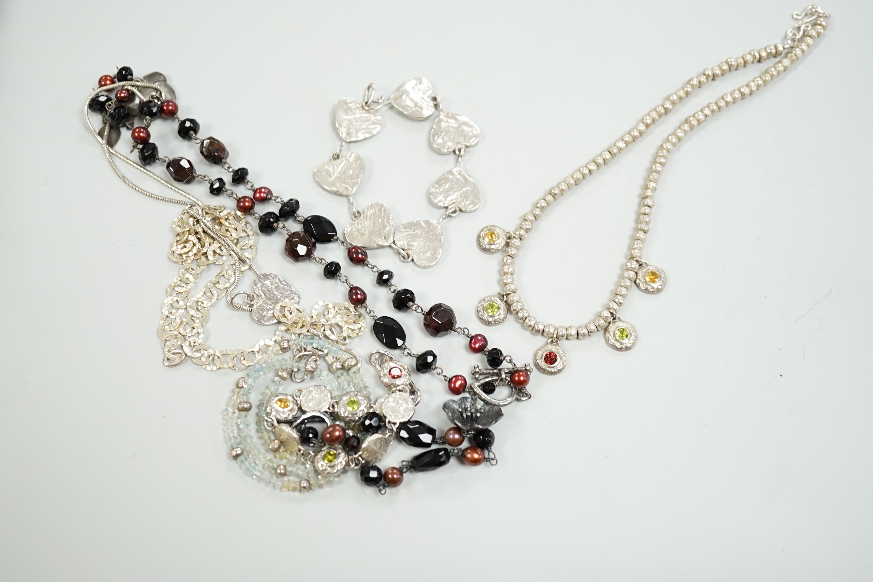 Two Pruden Smith silver necklaces and a similar bracelet, three other assorted silver necklaces and two silver bracelets, some with beads, largest 50cm.